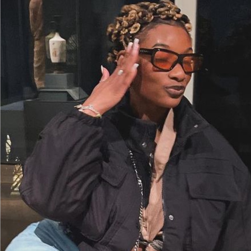 Black Marni glasses with red lenses, case included.